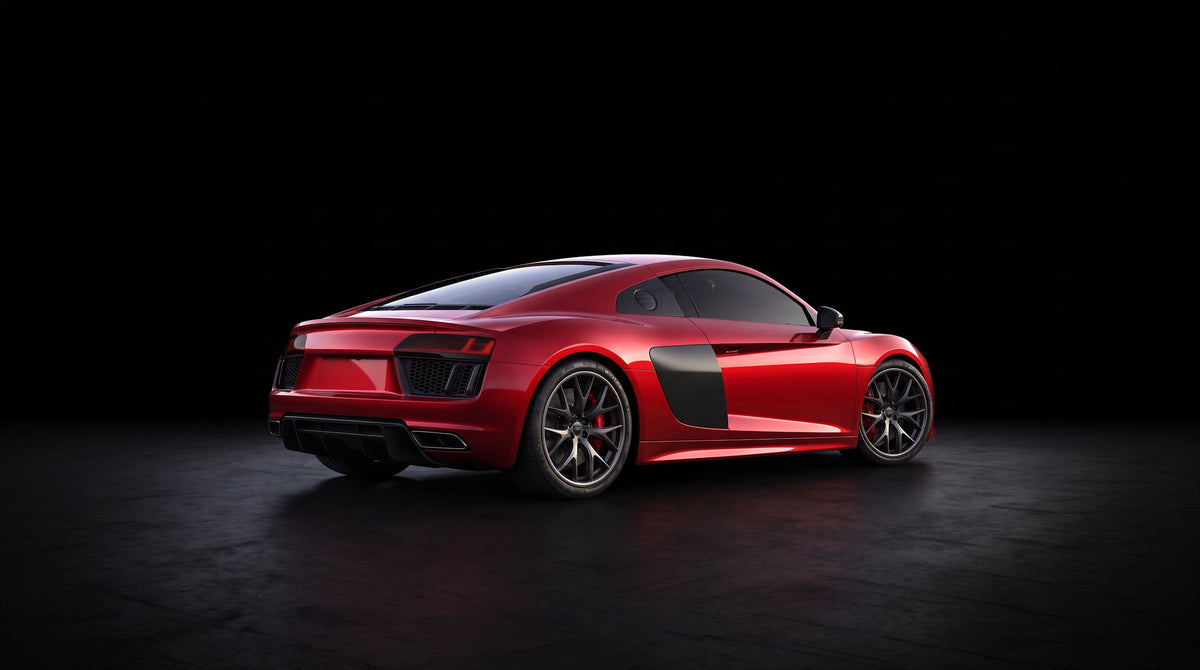 Red Audi R8 with smoked taillights on a dark studio background